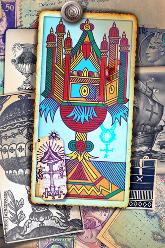 Ace of tarot cups on a background of esoteric cards, and astrological and alchemical symbols