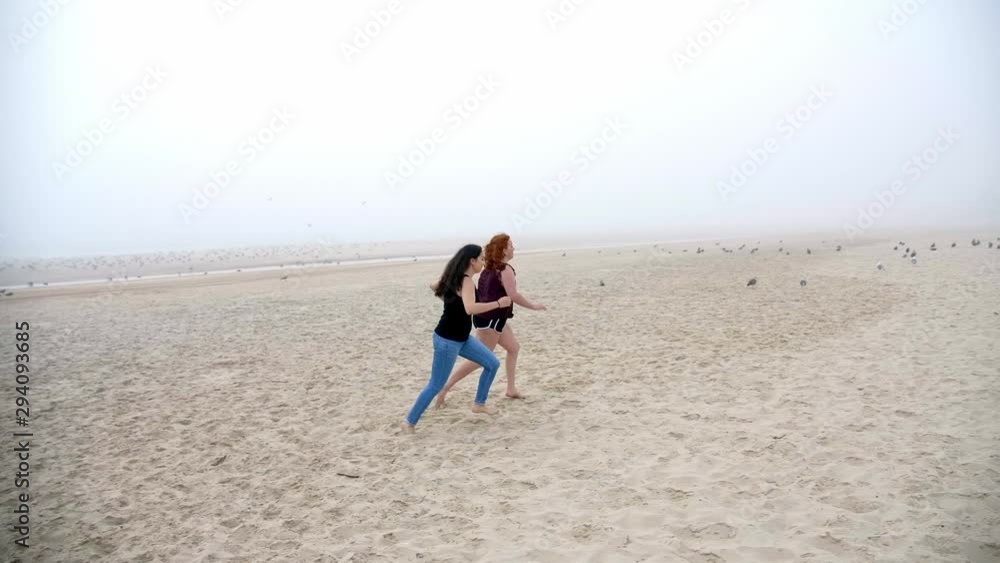 A carefree relaxing day at the beach - beautiful girls on summer holiday - slow motion shot A carefree relaxing day at the beach - beautiful girls on summer holiday - slow motion shot