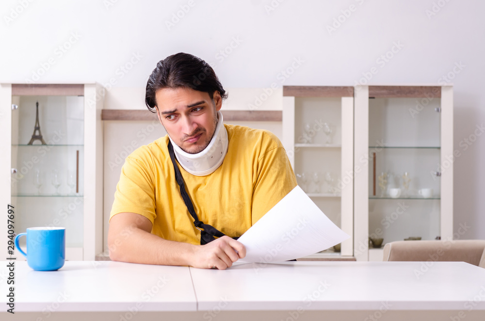 Young man after car accident suffering at home Young man after car accident suffering at home