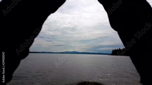 extreme close of a lady with hands clasping up towards heaven like showing respect and amusement to the beautiful evening scenery. photo