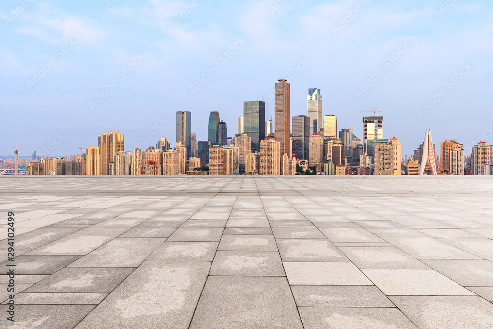 Empty square floor and modern city skyline in chongqing at sunrise,China.