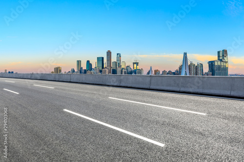 Asphalt highway passes through the city financial district in Chongqing at sunrise,China.