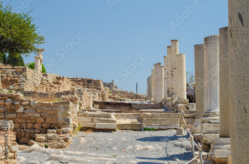 Turkey, Aegean, Izmir. Ruins of ancient Greek city Ephesus (Efes). Columns of white marble, destroyed buildings. Famous open-air museum. Popular tourist location. Selective focus.