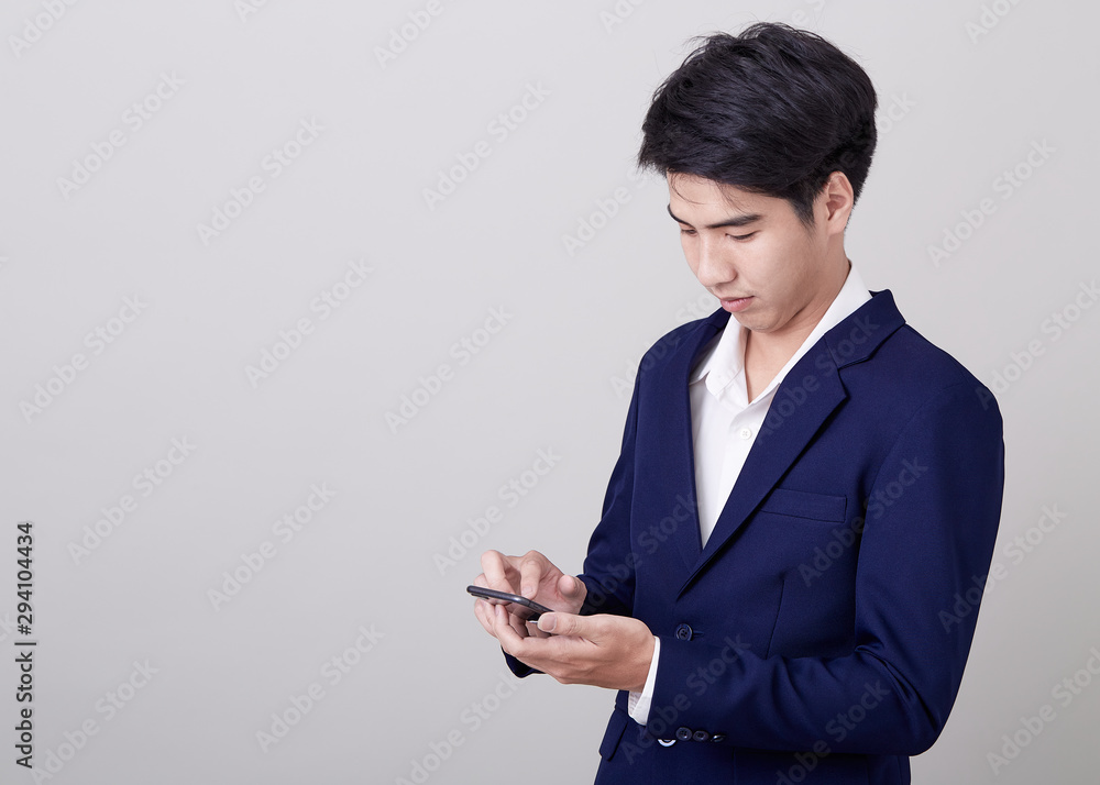 Young asian businessman using a smart phone Young asian businessman using a smart phone
