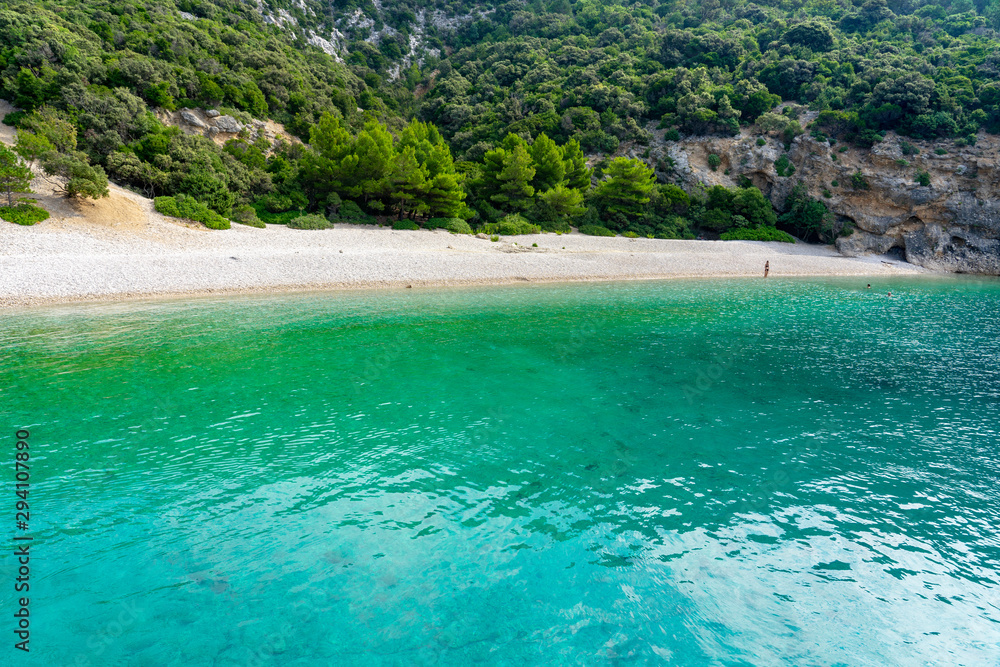 Hidden Lubenice beach in Cres island Croatia with crystal clear turquoise water