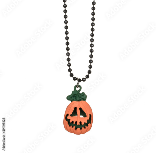 kids Necklace pendant of jack-o-lantern pumpkin, Halloween jack o lantern character, close up and isolated on white background
