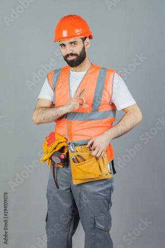 Studio portrait of a Builder, on a gray background