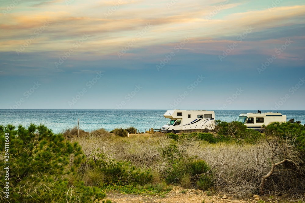 Camper cars on beach, camping on nature Camper cars on beach, camping on nature
