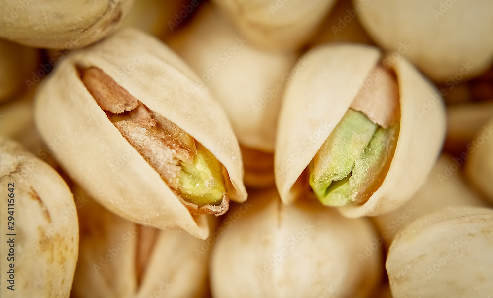 Salty pistachios. Selective focus. Tasty nuts. Popular snack. Salty pistachios. Selective focus. Tasty nuts. Popular snack.