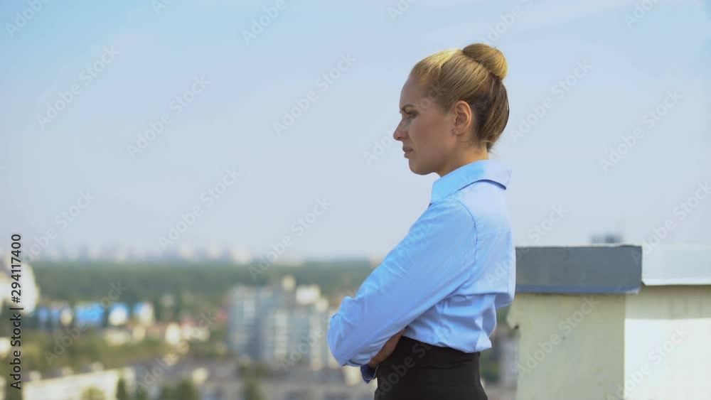 Worried business woman thinking of problem at outdoor office terrace, stress Worried business woman thinking of problem at outdoor office terrace, stress