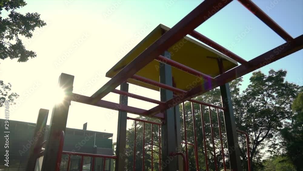 Children playground, with morning sun rays shining through Children playground, with morning sun rays shining through