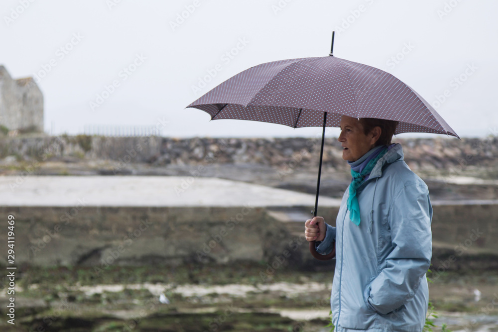 woman with umbrella in autumn