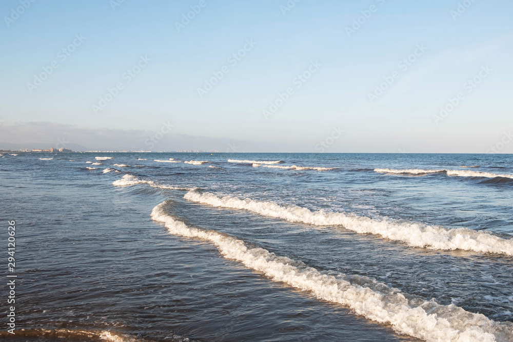 sea with waves and blue sky