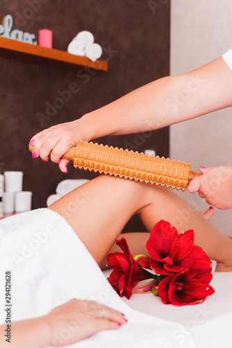 Maderotherapy anticellulite massage treatment of leg