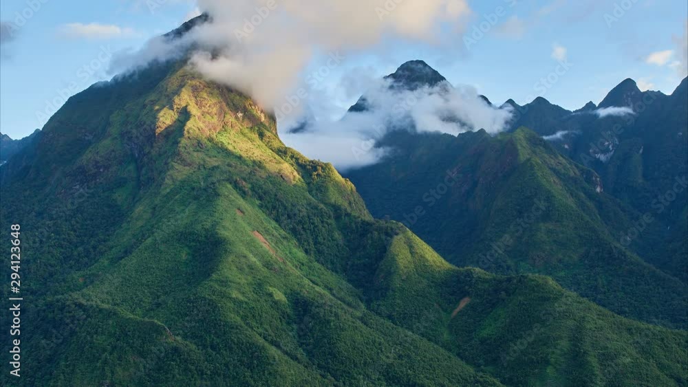 Hoang Lien National Park. Zoom in timelapse of the running clouds in mountains with river and rice terraces on the foreground, north Vietnam.