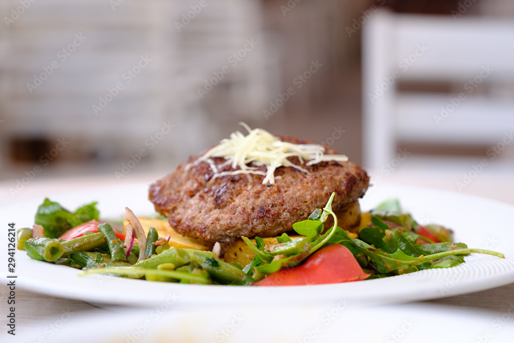 Fried chop on a pillow of vegetables Fried chop on a pillow of vegetables