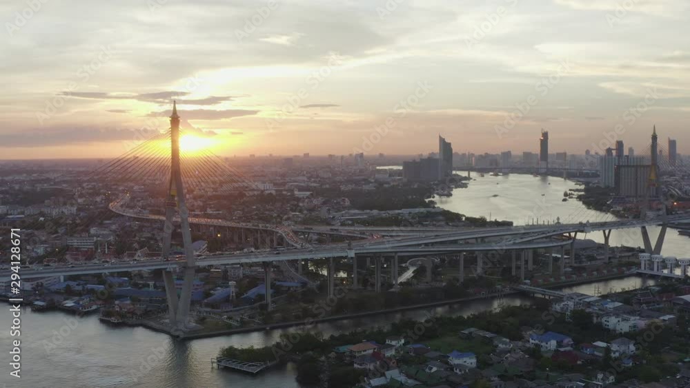 Aerial drone shot over Bhumibol bridge known as Industrial Ring Road Bridge connecting southern Bangkok with Samut Prakan. The bridge crosses the Chao Phraya River to solve traffic problem. Aerial drone shot over Bhumibol bridge known as Industrial Ring Road Bridge connecting southern Bangkok with Samut Prakan. The bridge crosses the Chao Phraya River to solve traffic problem.