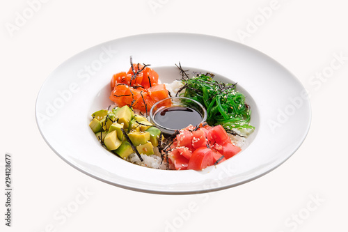 Salmon sashimi rice bowl with avocado, seawed, tomato and soy sauce isolated on white