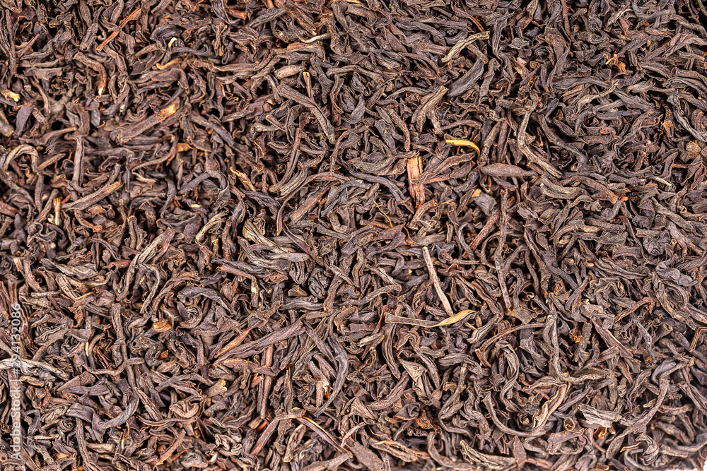 Black tea leaves background. Abstract food textures. Close up Black tea leaves background. Abstract food textures. Close up