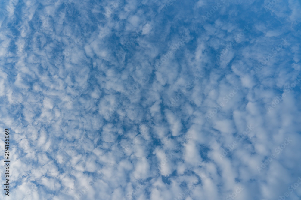 White clouds over blue sky. Background sky with clouds. White clouds over blue sky. Background sky with clouds.