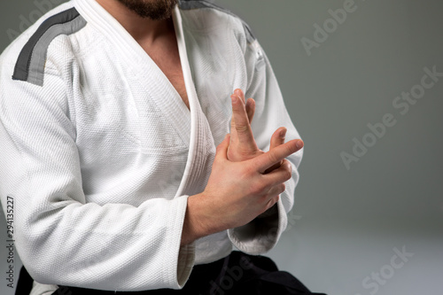 Two caucasian men are practicing aikido on the tatami