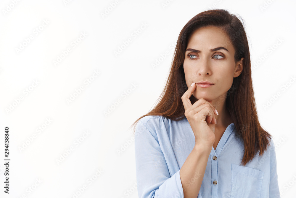 Close-up studio shot curious, serious-looking businesswoman pondering important business choice, look sideways copy space thoughtful, make assumption stare focused curious, touch lip thinking Close-up studio shot curious, serious-looking businesswoman pondering important business choice, look sideways copy space thoughtful, make assumption stare focused curious, touch lip thinking