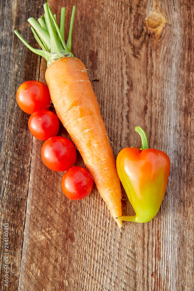 Orange vegetables. Composition of carrots pepper and tomato Orange vegetables. Composition of carrots pepper and tomato