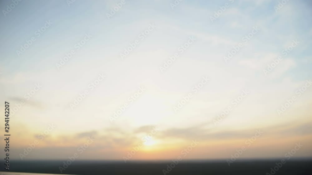 Couple clinking champagne glasses against sunset background, romantic date Couple clinking champagne glasses against sunset background, romantic date