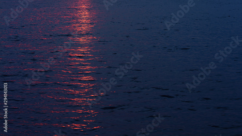 Sunset reflecting on the surface of lake water