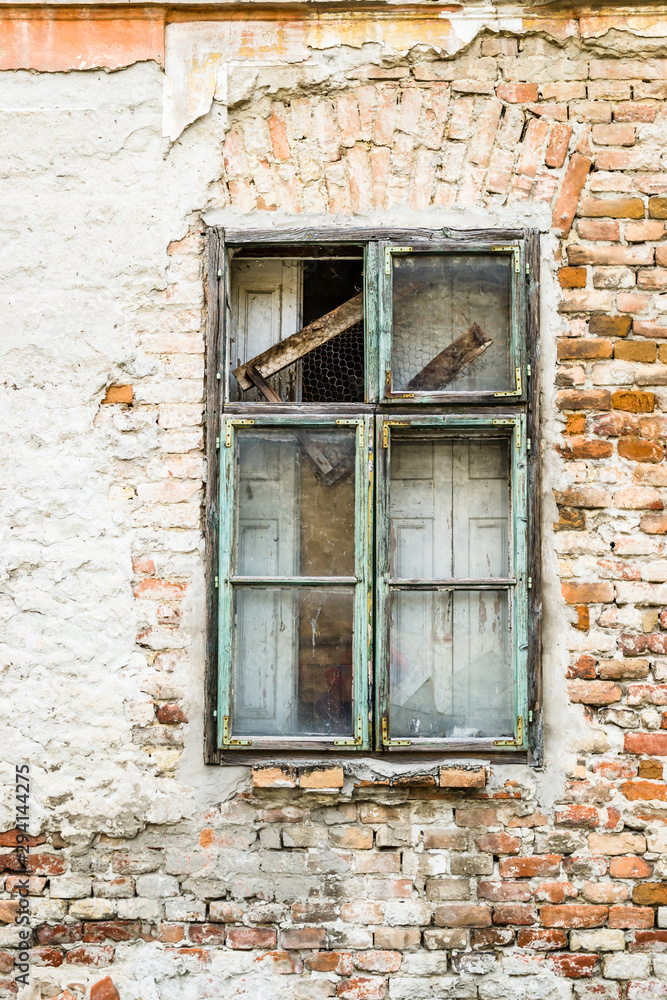 The old dilapidated wooden window frame The old dilapidated wooden window frame