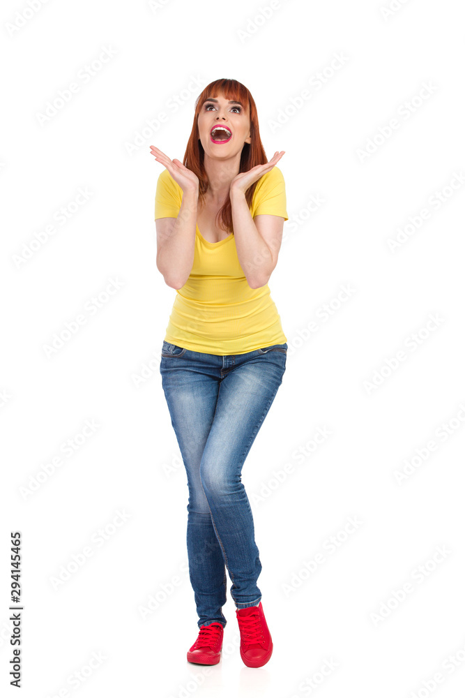 Excited Young Woman Is Holding Head In Hands Looking Up And Shouting Excited Young Woman Is Holding Head In Hands Looking Up And Shouting