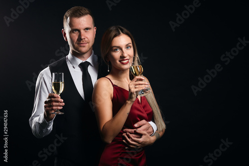 smiling positive elegant woman and man in trendy evening clothes having a romantic date, weekend with favourite people