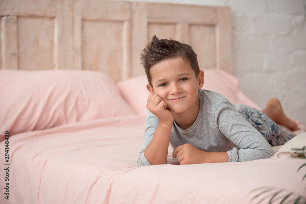 Funny brunette boy cute in his bed Funny brunette boy cute in his bed