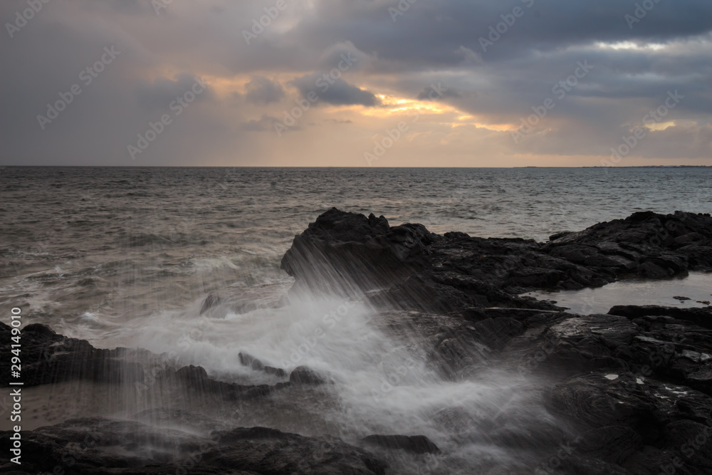Ocean during a storm with seagulls and rocky horizon Ocean during a storm with seagulls and rocky horizon