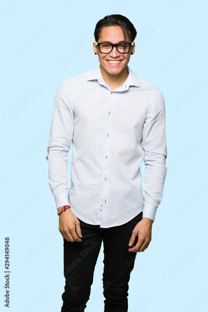 Handsome man with glasses and happy over isolated blue background Handsome man with glasses and happy over isolated blue background