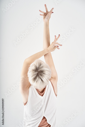 young woman in white dress yoga