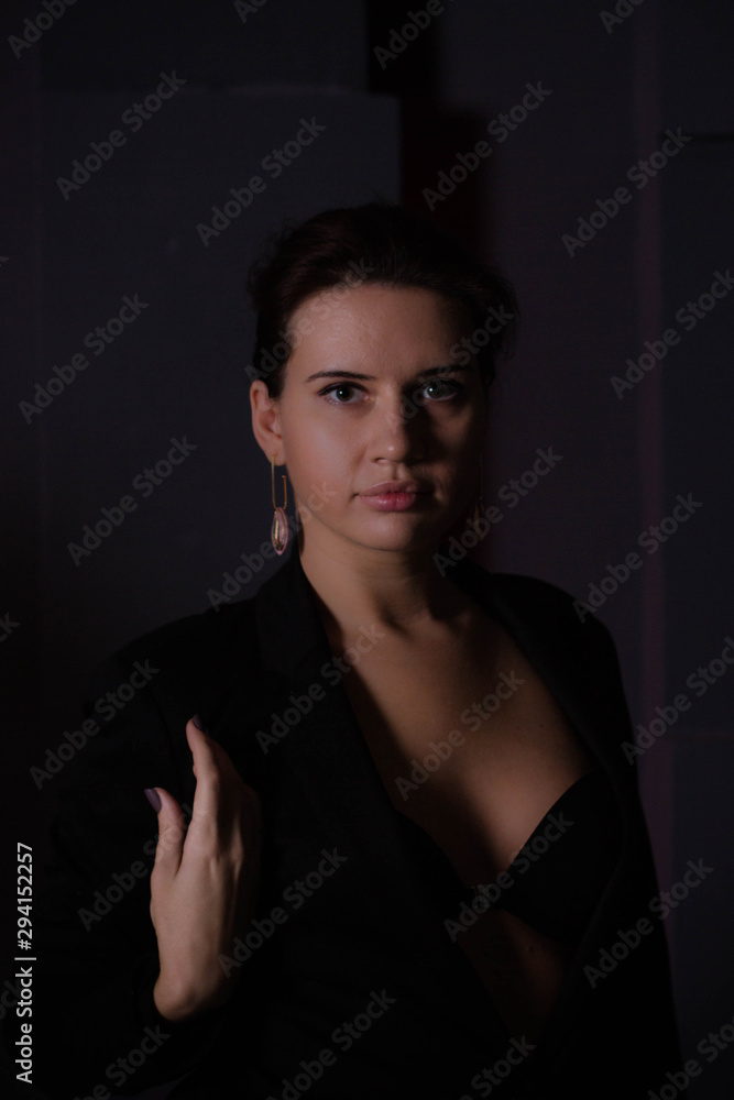 brunette in a black jacket brunette in a black jacket