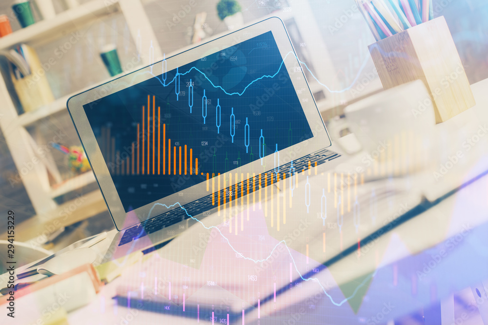 Forex market chart hologram and personal computer background. Double exposure. Concept of investment. Forex market chart hologram and personal computer background. Double exposure. Concept of investment.