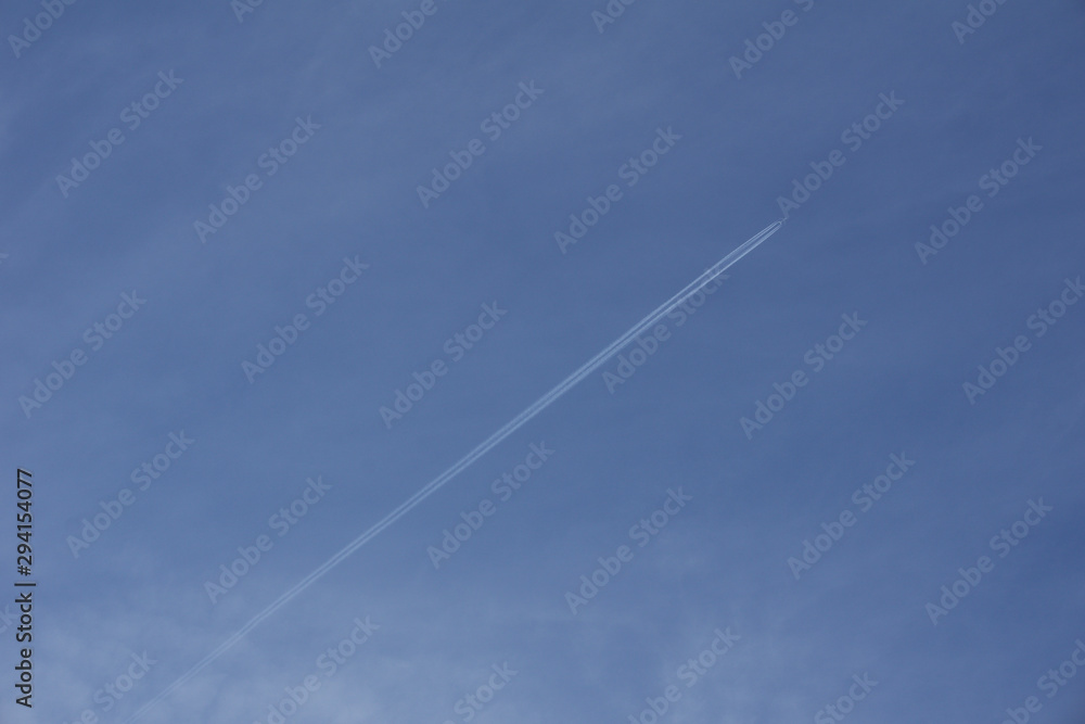 Vapour trail across clear blue sky Vapour trail across clear blue sky