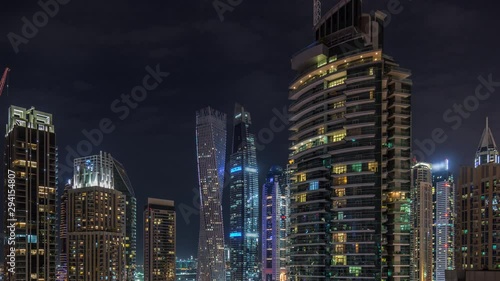Wallpaper Mural View of various skyscrapers and towers in Dubai Marina from above aerial night timelapse. Illuminated modern buildings in urban skyline Torontodigital.ca