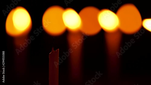 Extinguished Candle With Smoke. Burning candle blown out by wind with smoke trail in the dark night environment with copy space. Background clip of Diwali, festive season, death, bad news, horror.