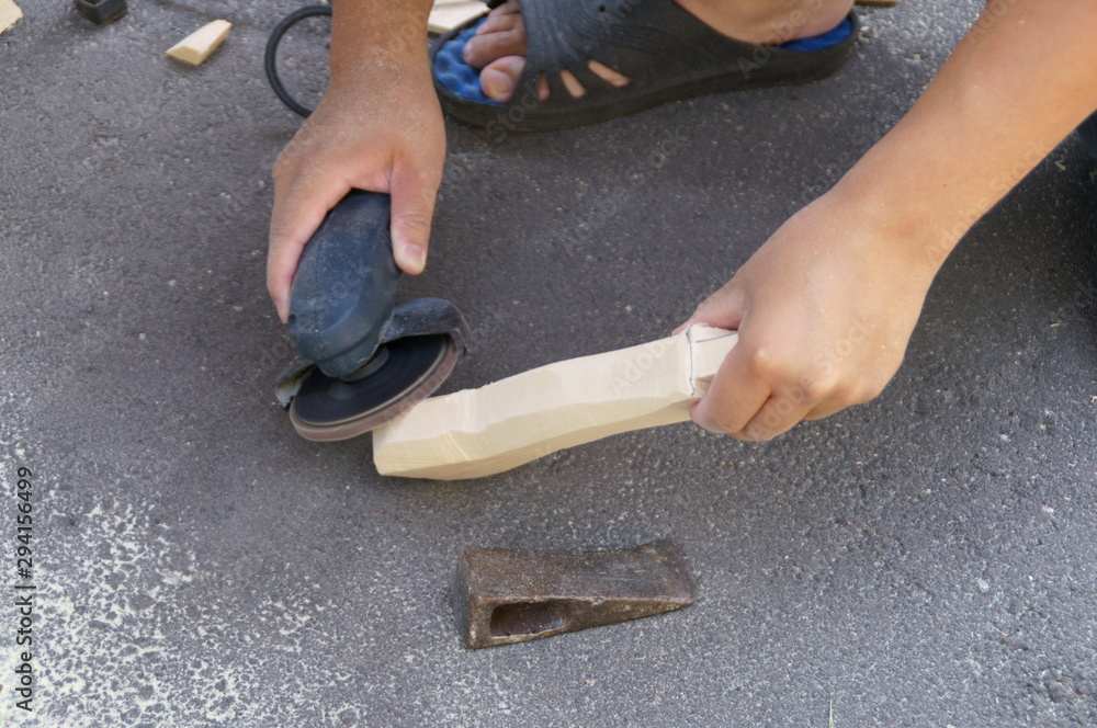 Woodworking the handle of the ax Woodworking the handle of the ax