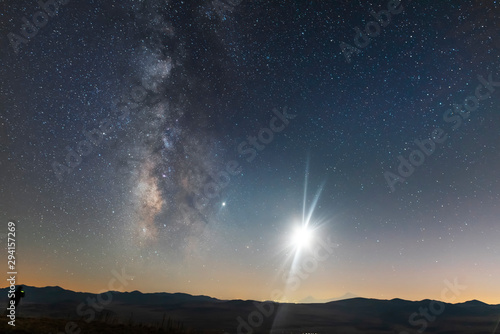 Beautiful milky way galaxy and moon over the hill. Night landscape, astronomical background.