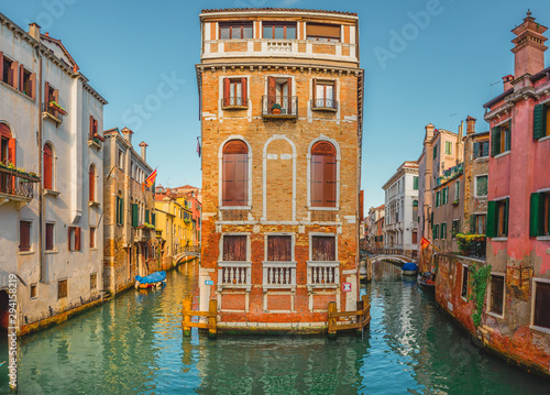Fototapeta Naklejka Na Ścianę i Meble -  View of the street canal in Venice, Italy. Colorful facades of old Venice houses standing in water. Venice, Italy