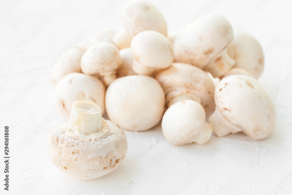 Champignon mushrooms on white background. 