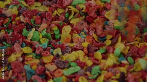 close up shot dropping fruity pebbles cereals, real time