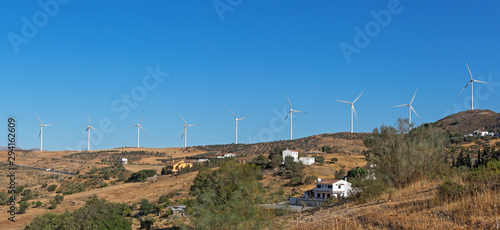 The landscape with wind power plant. Wind power station. Wind generators in the mountains. Alternative green renewable energy production. Panorama