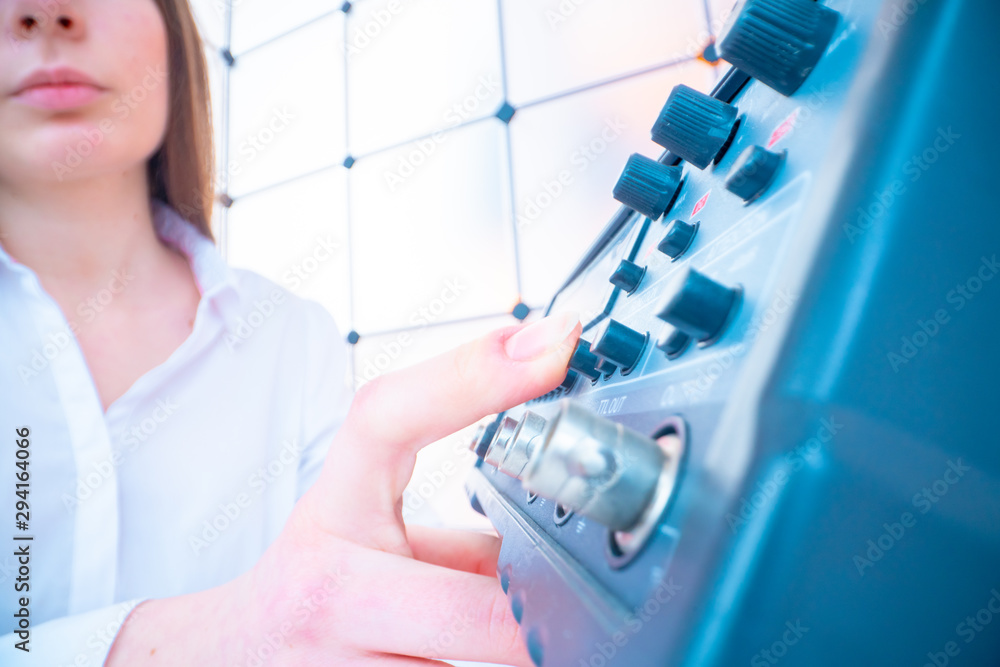 Young woman engineer work with measuring devices in the electronics laboratory Young woman engineer work with measuring devices in the electronics laboratory