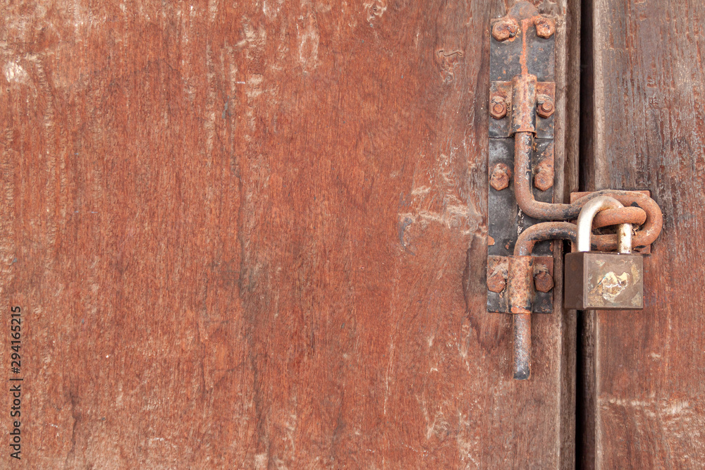 The Rusty lock with wood door, Old lock close home door. The Rusty lock with wood door, Old lock close home door.
