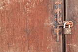 The Rusty lock with wood door, Old lock close home door.